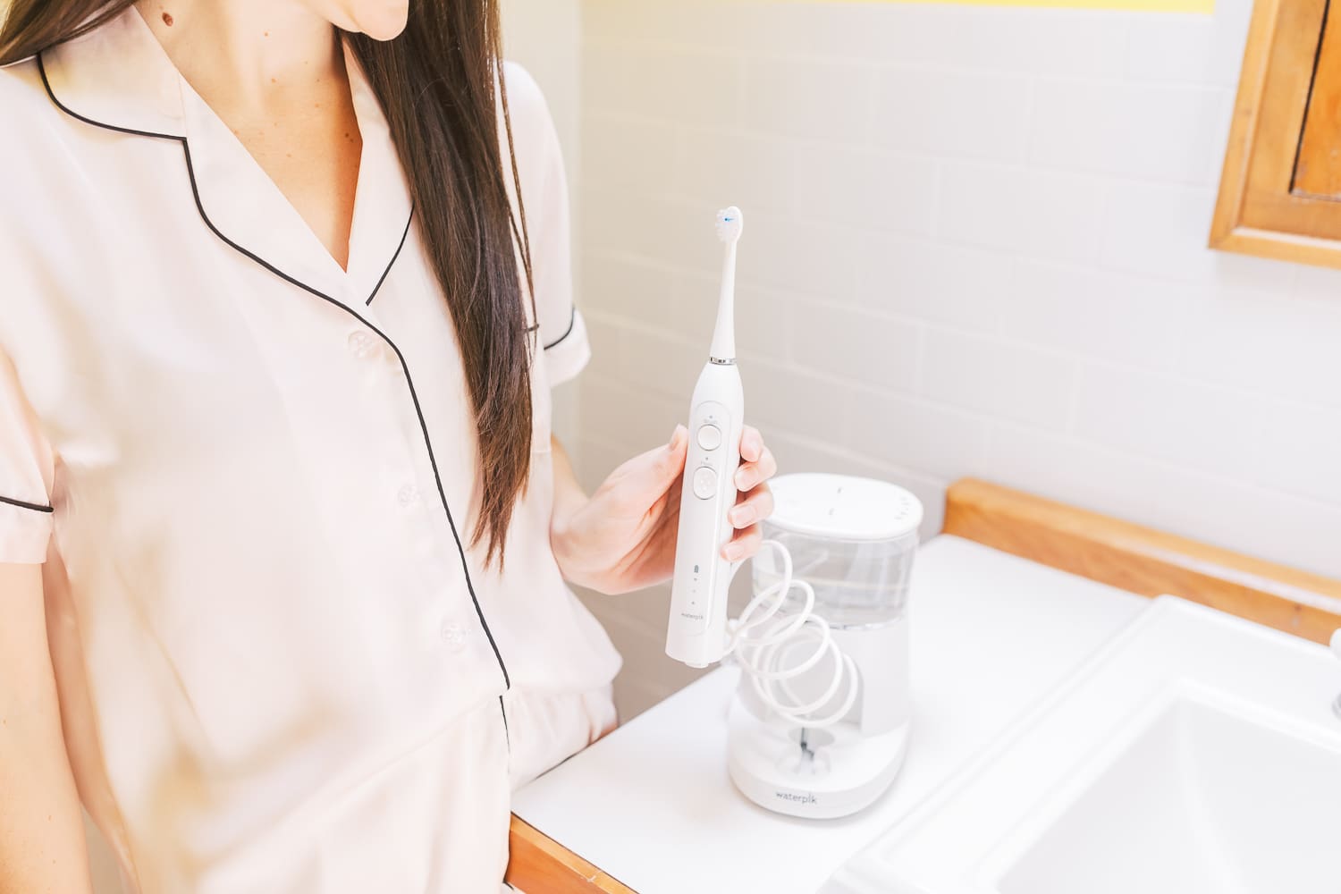 Waterpik Sonic Fusion Flossing Toothbrush, Sonic-Fushion Flossing Toothbrush Review by popular southern lifestyle blogger Stephanie Ziajka from Diary of a Debutante, morning self-care routine, drinking coffee on the couch, pink silk pajama set