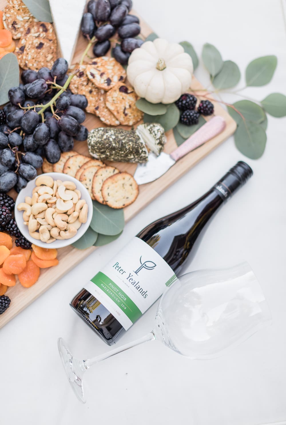Red wine and fall charcuterie plate created by blogger Stephanie Ziajka on Diary of a Debutante