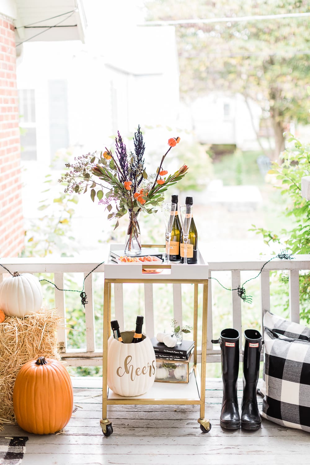 Halloween Bar Cart + DIY Pumpkin Ice Bucket Tutorial by popular affordable fashion blogger Stephanie Ziajka on Diary of a Debutante, Halloween bar cart ideas, how to decorate a halloween bar cart