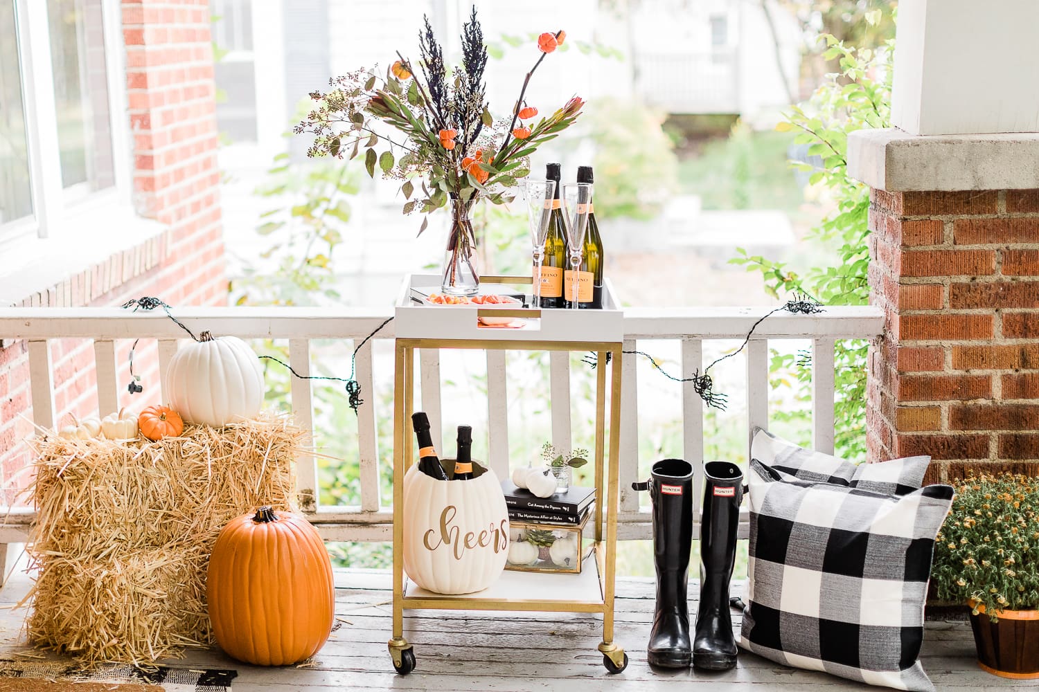 Halloween Bar Cart + DIY Pumpkin Ice Bucket Tutorial by popular affordable fashion blogger Stephanie Ziajka on Diary of a Debutante, Halloween bar cart ideas, how to decorate a halloween bar cart