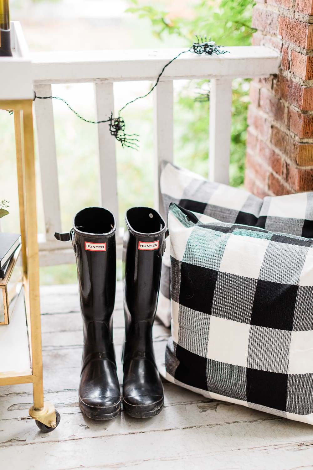 Black Hunter boots and Amazon black buffalo check pillows