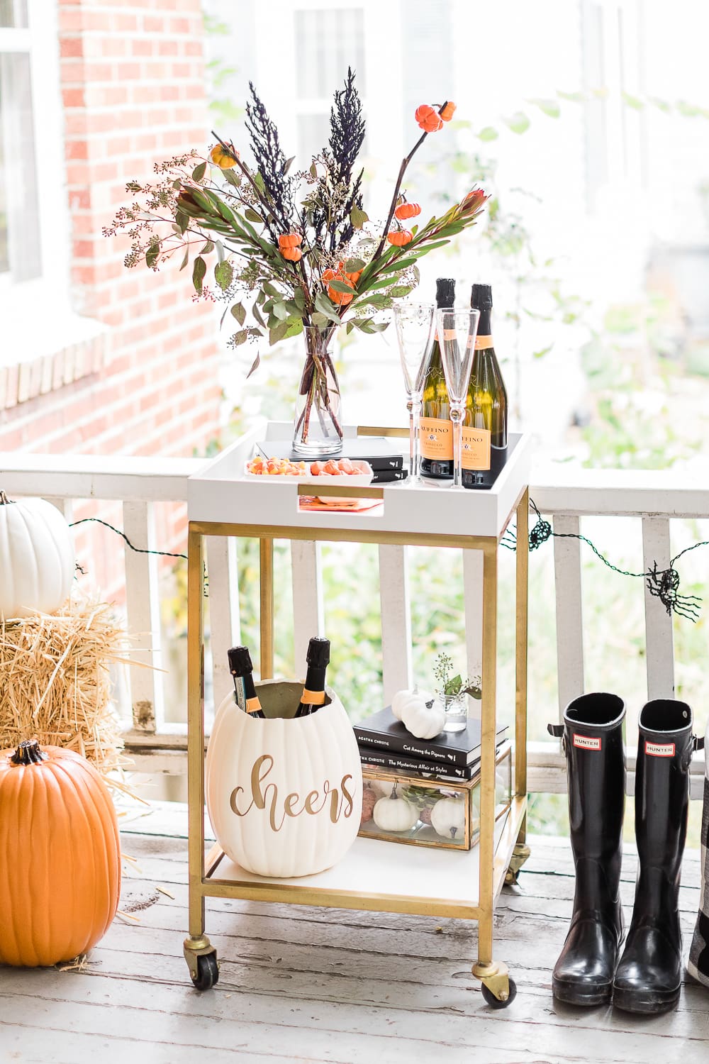 Halloween Bar Cart + DIY Pumpkin Ice Bucket Tutorial by popular affordable fashion blogger Stephanie Ziajka on Diary of a Debutante, Halloween bar cart ideas, how to decorate a halloween bar cart