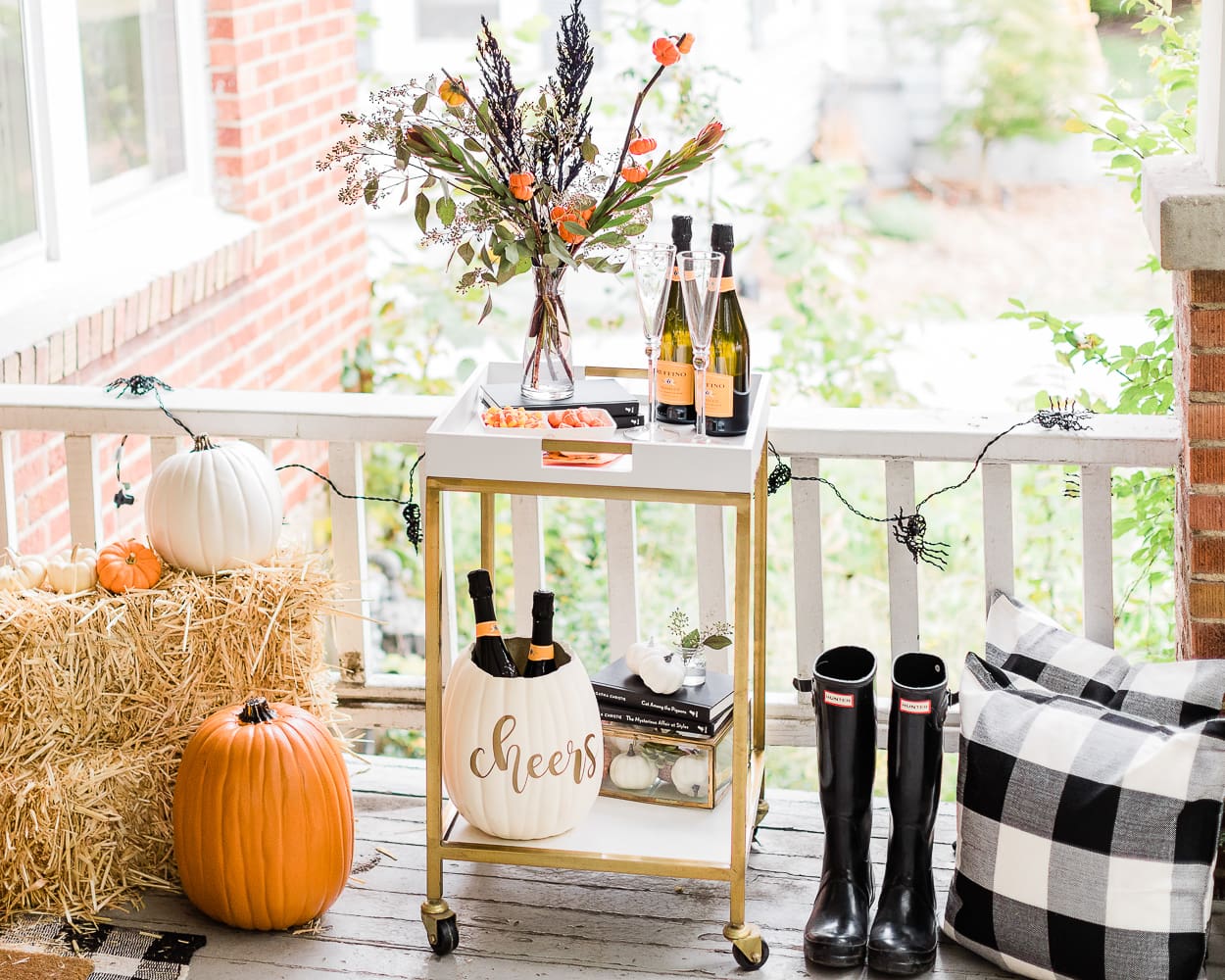 Halloween Bar Cart + DIY Pumpkin Ice Bucket Tutorial by popular affordable fashion blogger Stephanie Ziajka on Diary of a Debutante, Halloween bar cart ideas, how to decorate a halloween bar cart
