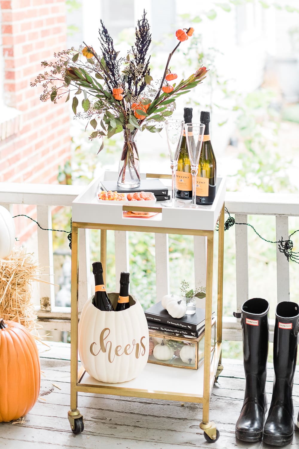 Halloween Bar Cart + DIY Pumpkin Ice Bucket Tutorial by popular affordable fashion blogger Stephanie Ziajka on Diary of a Debutante, Halloween bar cart ideas, how to decorate a halloween bar cart