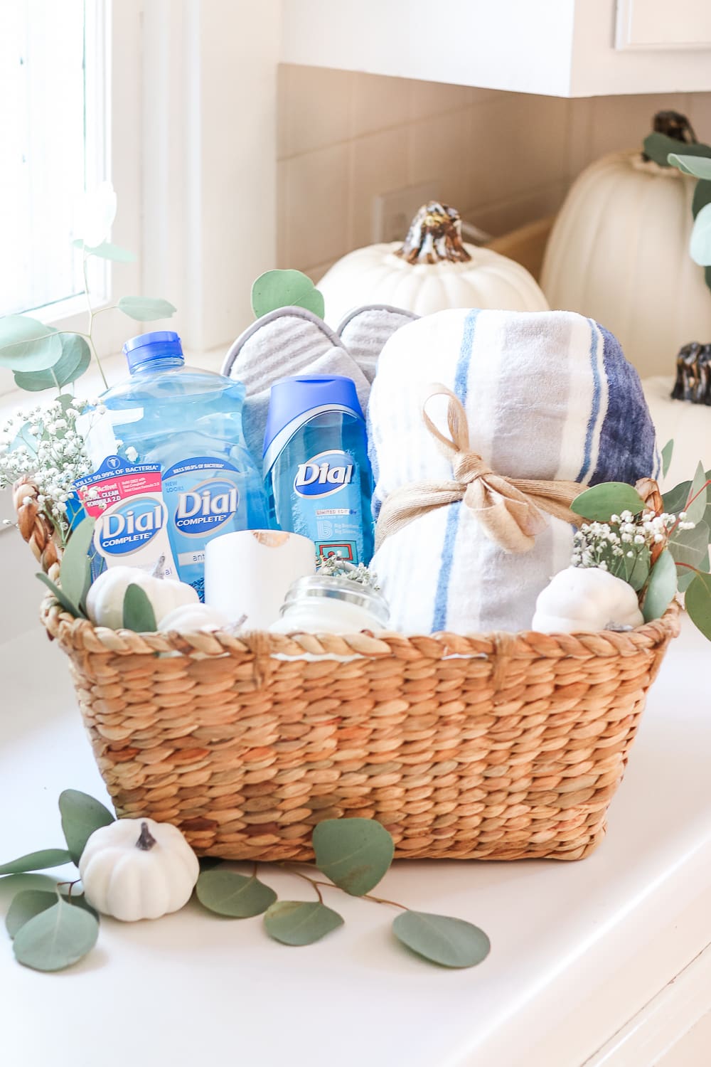 Practical Gift Basket Idea for Teachers, New Moms, and Volunteers by popular affordable entertaining blogger Stephanie Ziajka on Diary of a Debutante, eucalyptus in a gift basket, decorating gift basket with eucalyptus