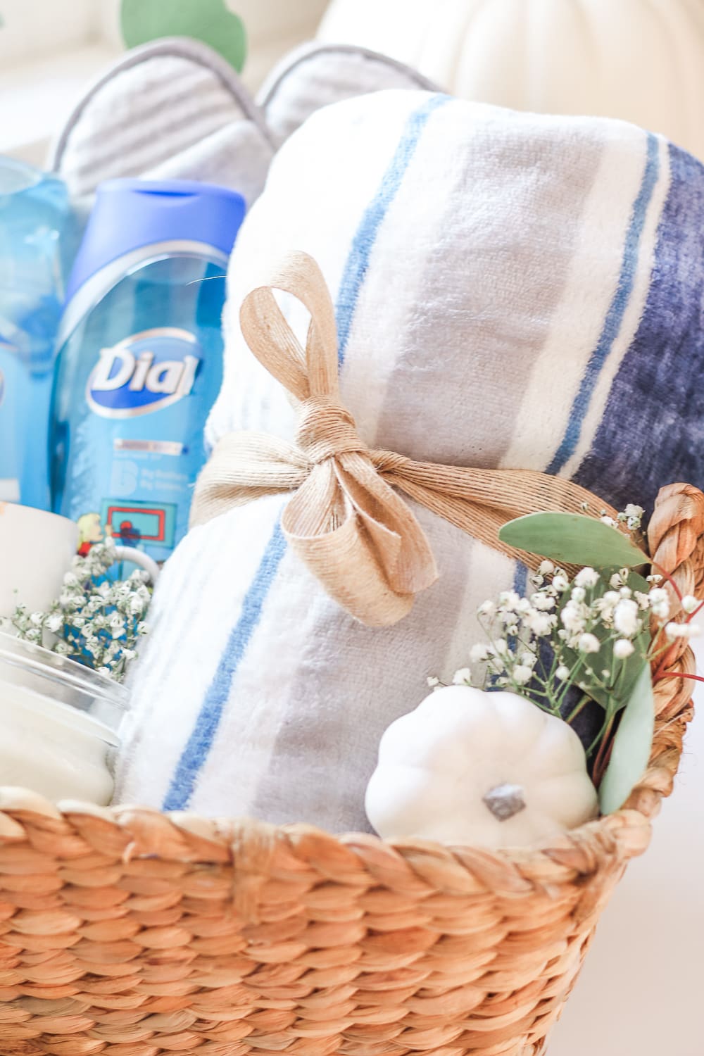 Blanked tied with natural mesh burlap ribbon, practical gift basket idea for teachers and new moms