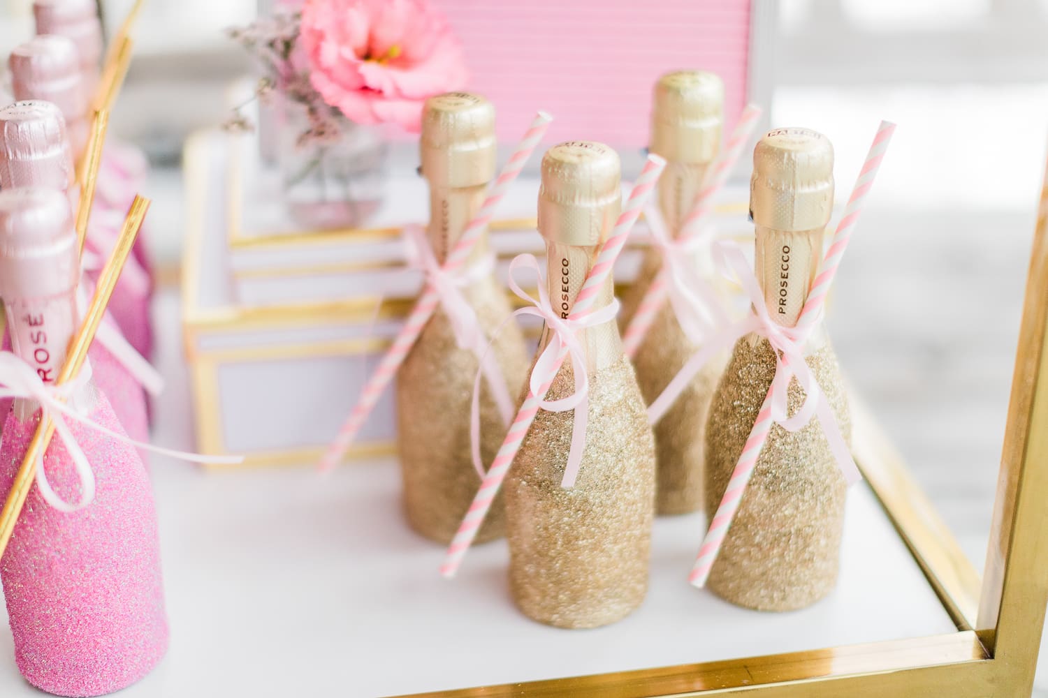 Southern lifestyle blogger Stephanie Ziajka shares a glitter prosecco bottle DIY project on Diary of a Debutante