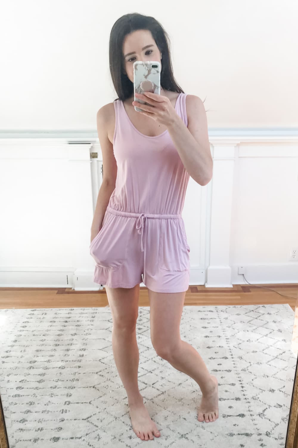 Affordable fashion blogger Stephanie Ziajka tries on a pink Amazon casual scoop neck romper with pockets as part of an Amazon try-on haul on Diary of a Debutante