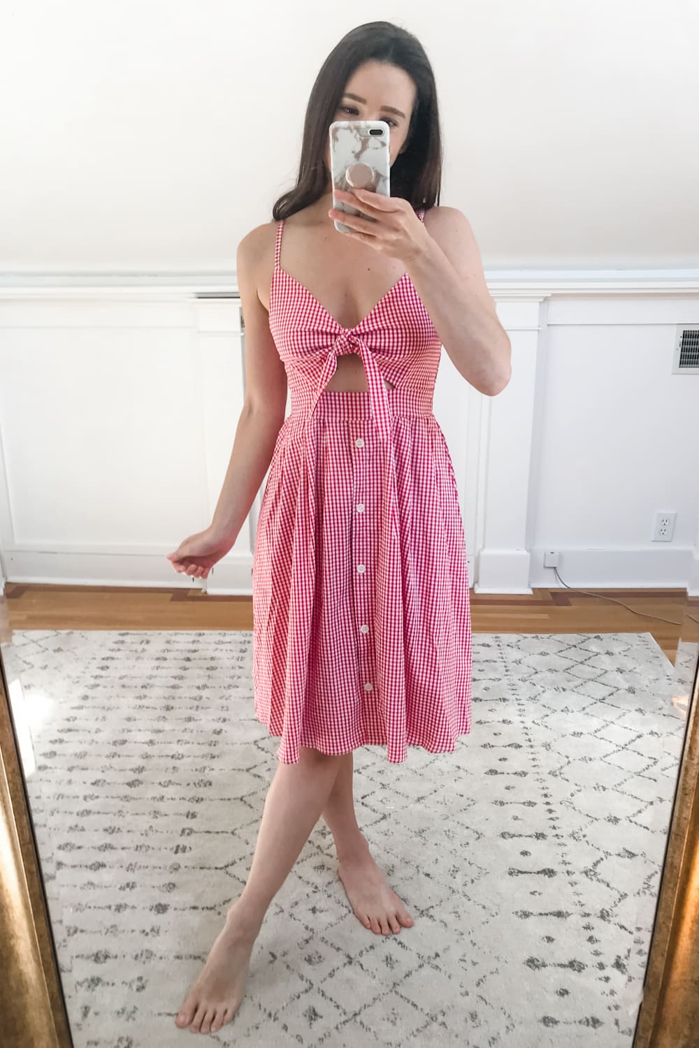 Affordable fashion blogger Stephanie Ziajka tries on an Amazon red gingham midi dress on Diary of a Debutante