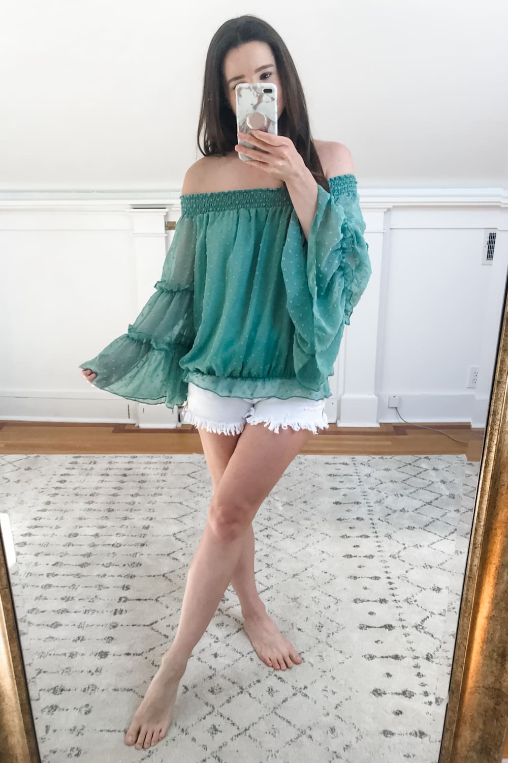 Affordable fashion blogger Stephanie Ziajka tries on a green Amazon off shoulder chiffon blouse with tiered bell sleeves on Diary of a Debutante