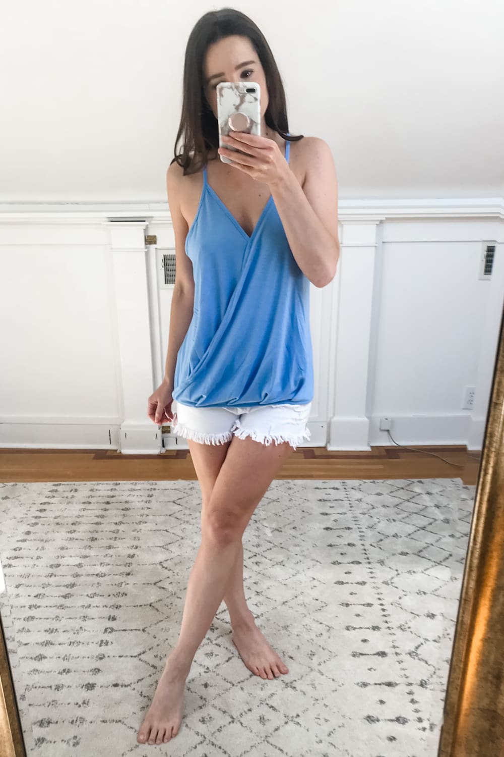 Affordable fashion blogger Stephanie Ziajka tries on a blue Amazon v neck wrap tank top on Diary of a Debutante