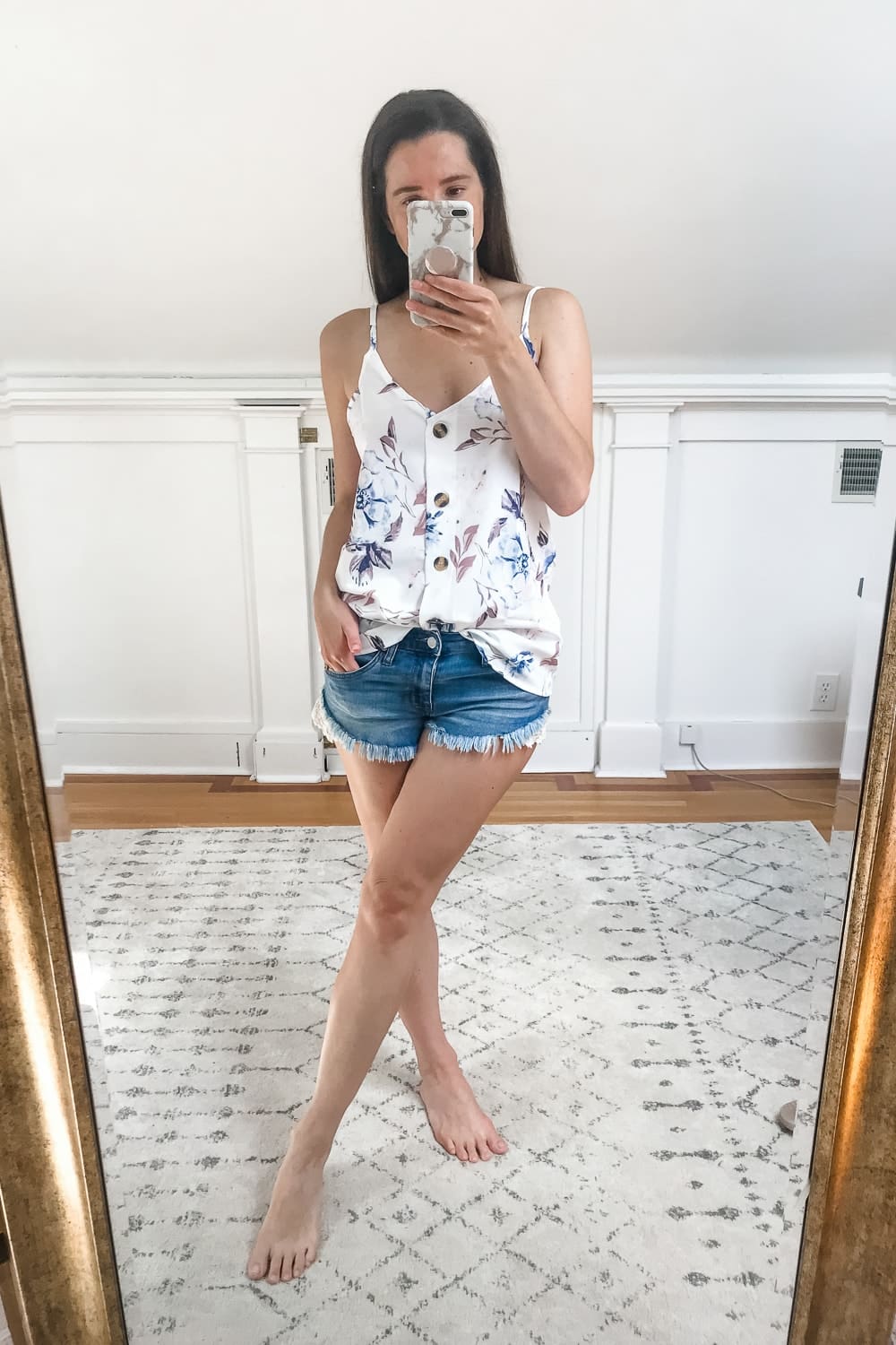 Affordable fashion blogger Stephanie Ziajka tries on a white floral Amazon button down tank on Diary of a Debutante