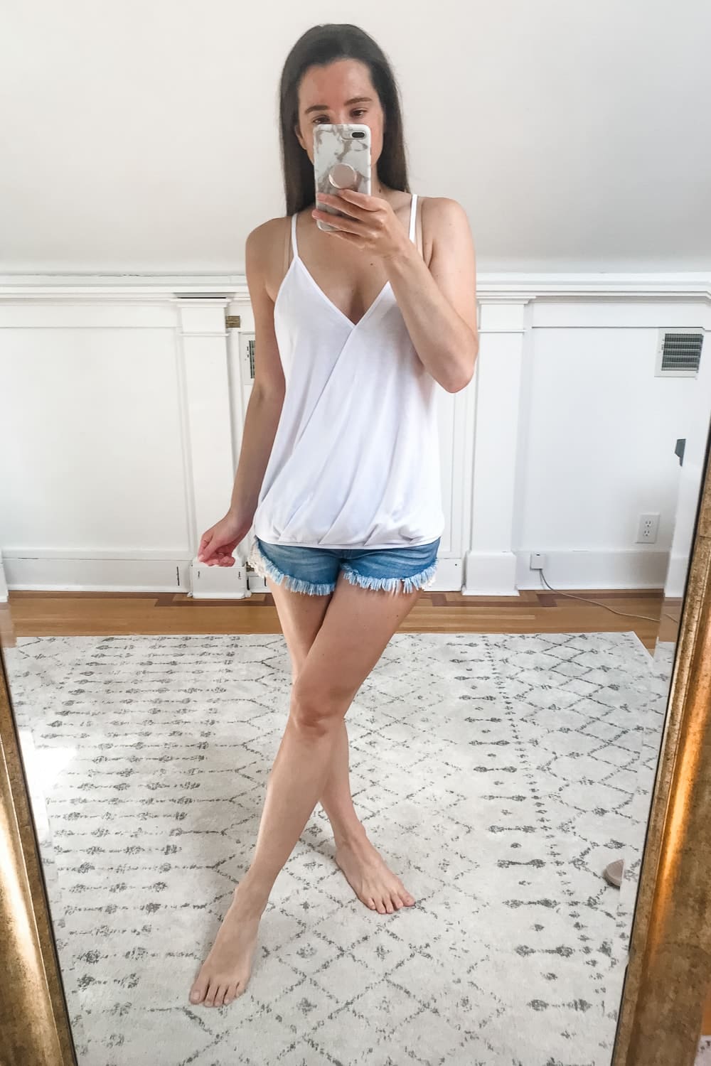 Affordable fashion blogger Stephanie Ziajka tries on a white Amazon wrap tank top on Diary of a Debutante