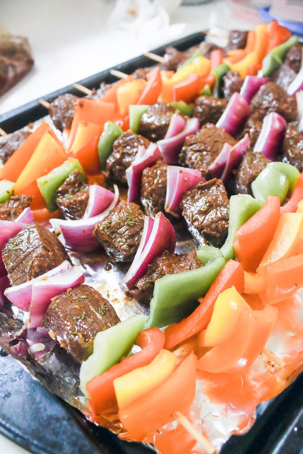 Blogger Stephanie Ziajka shows step three of how to make beef kabobs in the oven on Diary of a Debutante