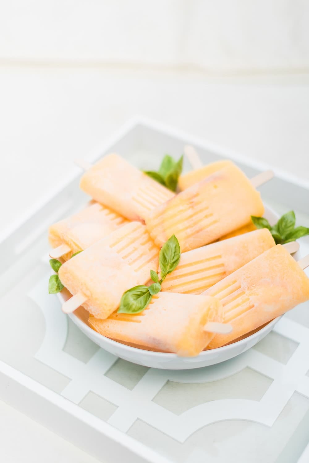 Boozy peach popsicles recipe by southern lifestyle blogger Stephanie Ziajka on Diary of a Debutante