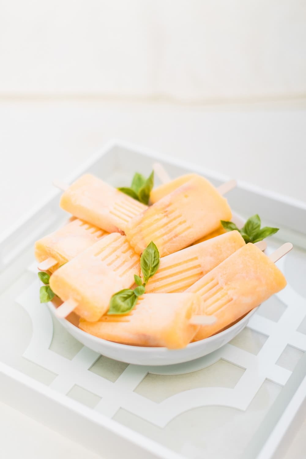 Boozy bellini ice pops made by southern lifestyle blogger Stephanie Ziajka on Diary of a Debutante