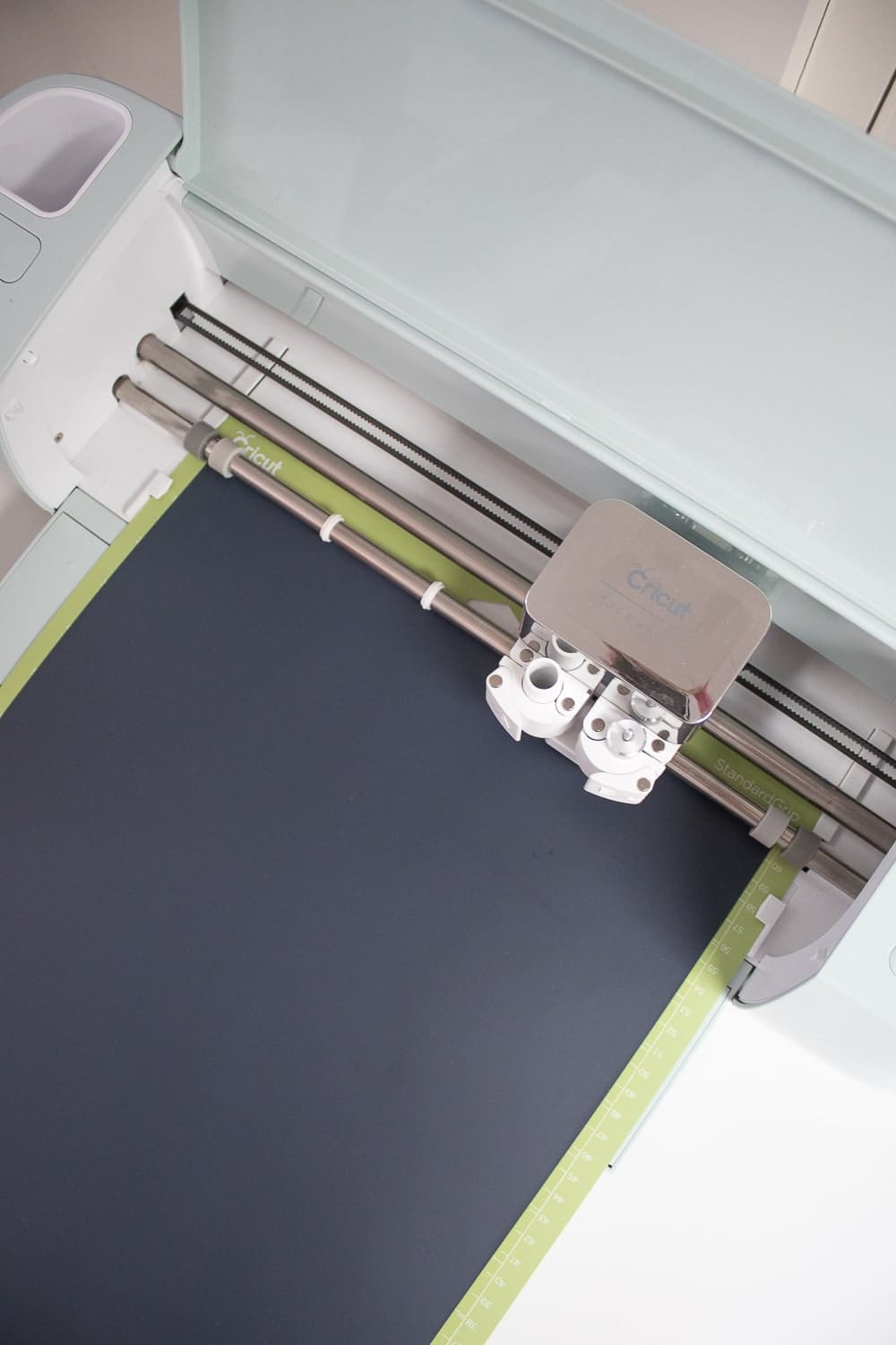 Step one of DIY blogger Stephanie Ziajka's easiest cricut iron on vinyl ideas on Diary of a Debutante