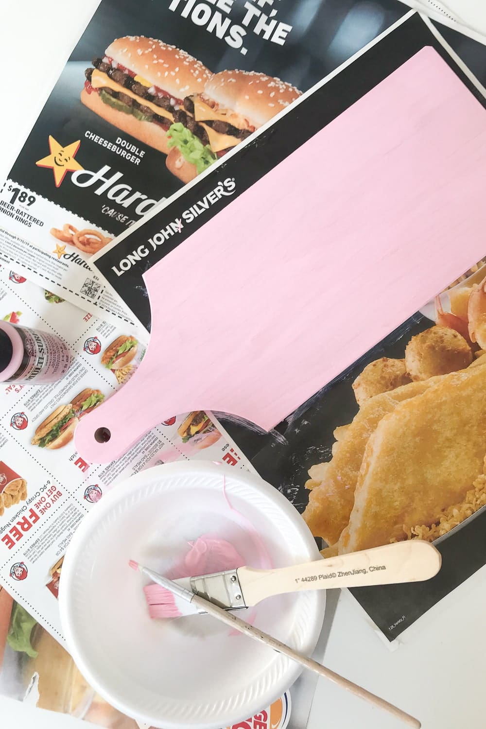 Blogger Stephanie Ziajka uses non-toxic pink acrylic paint to make her own personalized cheese board on Diary of a Debutante