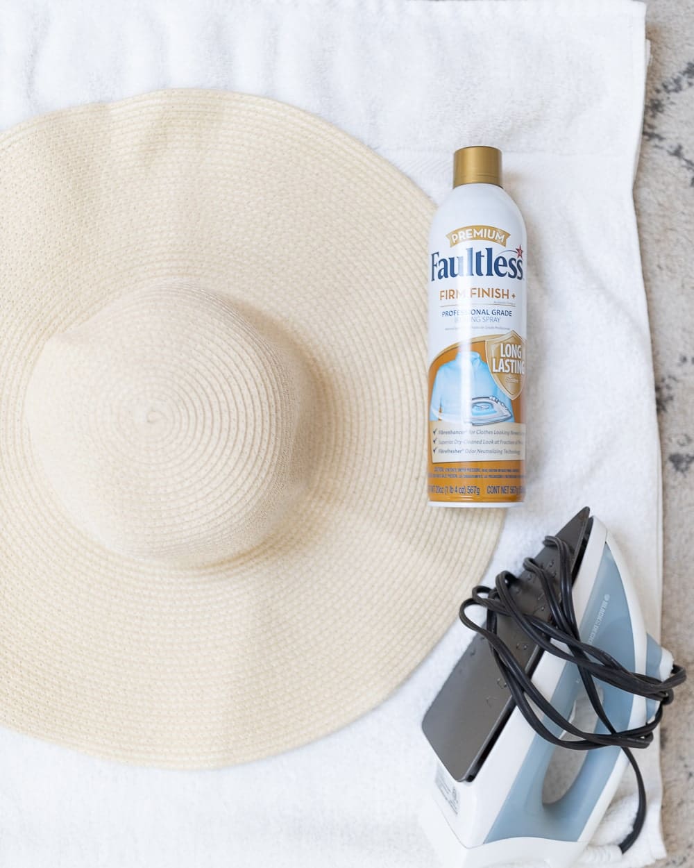 Southern blogger Stephanie Ziajka shows how to reshape a straw hat with starch spray and an iron on Diary of a Debutante 