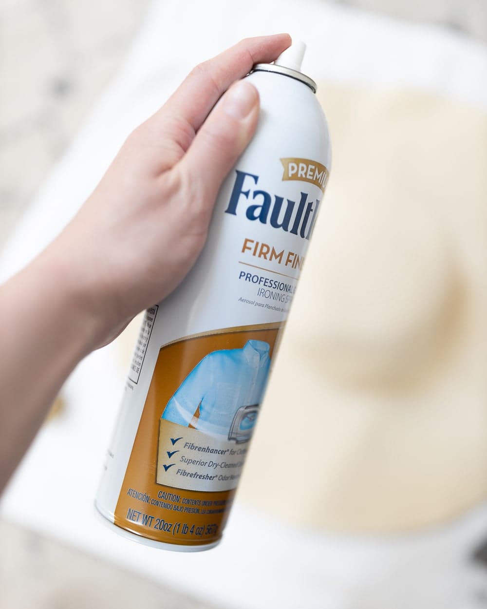 Blogger Stephanie Ziajka shows how to use starch spray to make a hat stiff again on Diary of a Debutante