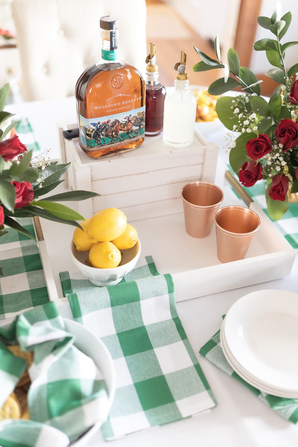 Woodford Reserve Kentucky Derby bottle styled as the centerpiece in blogger Stephanie Ziajka's Derby Day tablescape on Diary of a Debutante