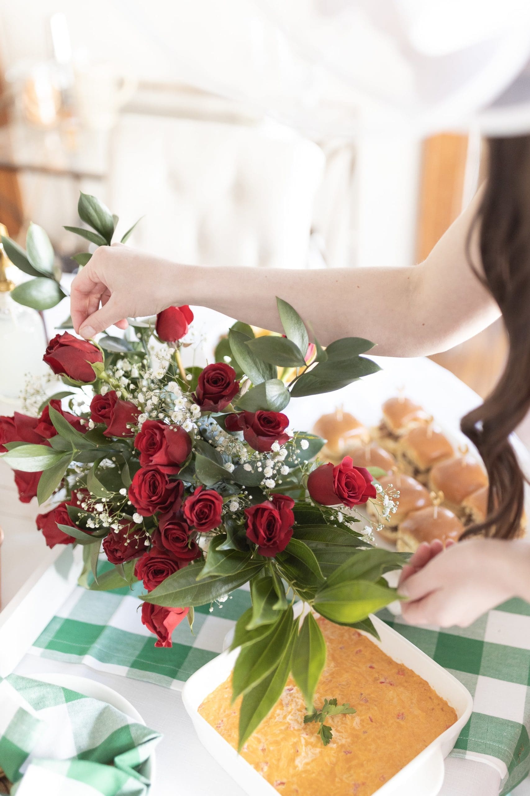 Red rose Kentucky Derby table decorations designed by blogger Stephanie Ziajka on Diary of a Debutante