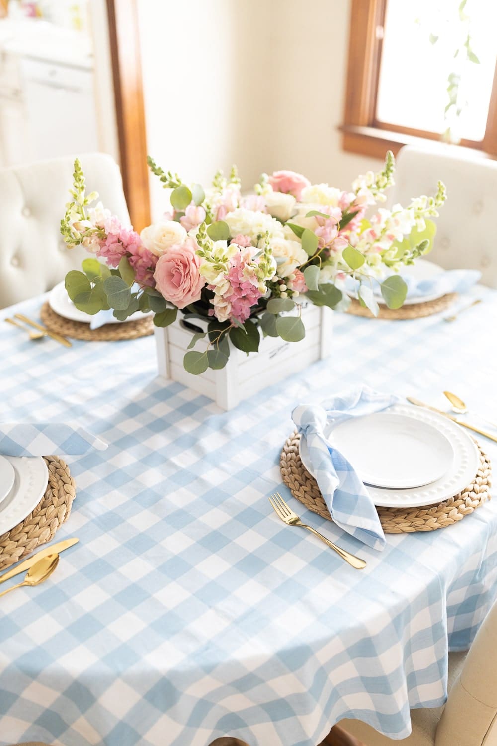 Mother’s Day centerpiece idea created by blogger Stephanie Ziajka with snapdragons, pink and white roses, light pink carnations, alstroemeria, and silver dollar eucalyptus on Diary of a Debutante