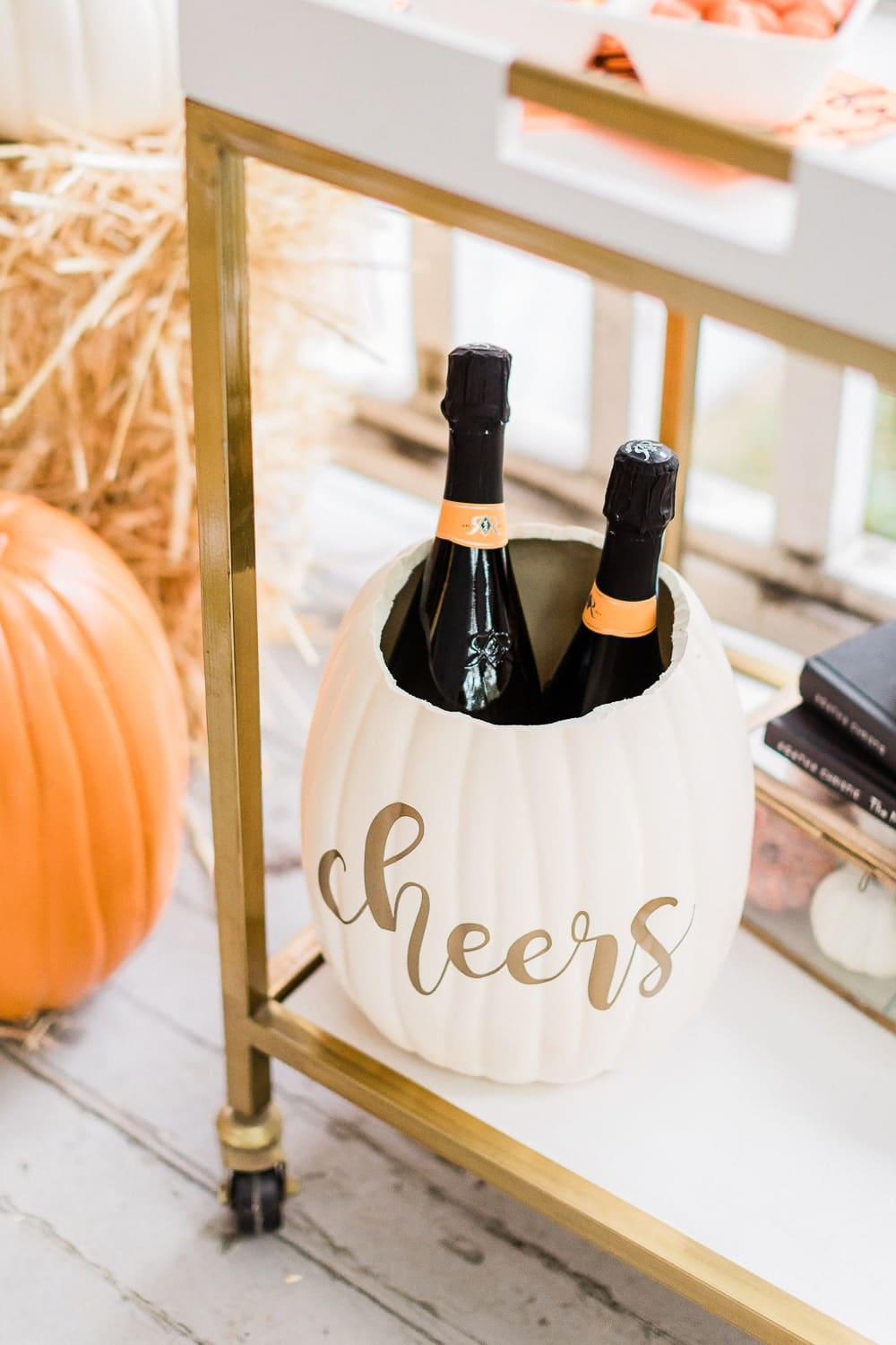 DIY blogger Stephanie Ziajka shares a DIY pumpkin ice bucket Cricut tutorial on Diary of a Debutante 