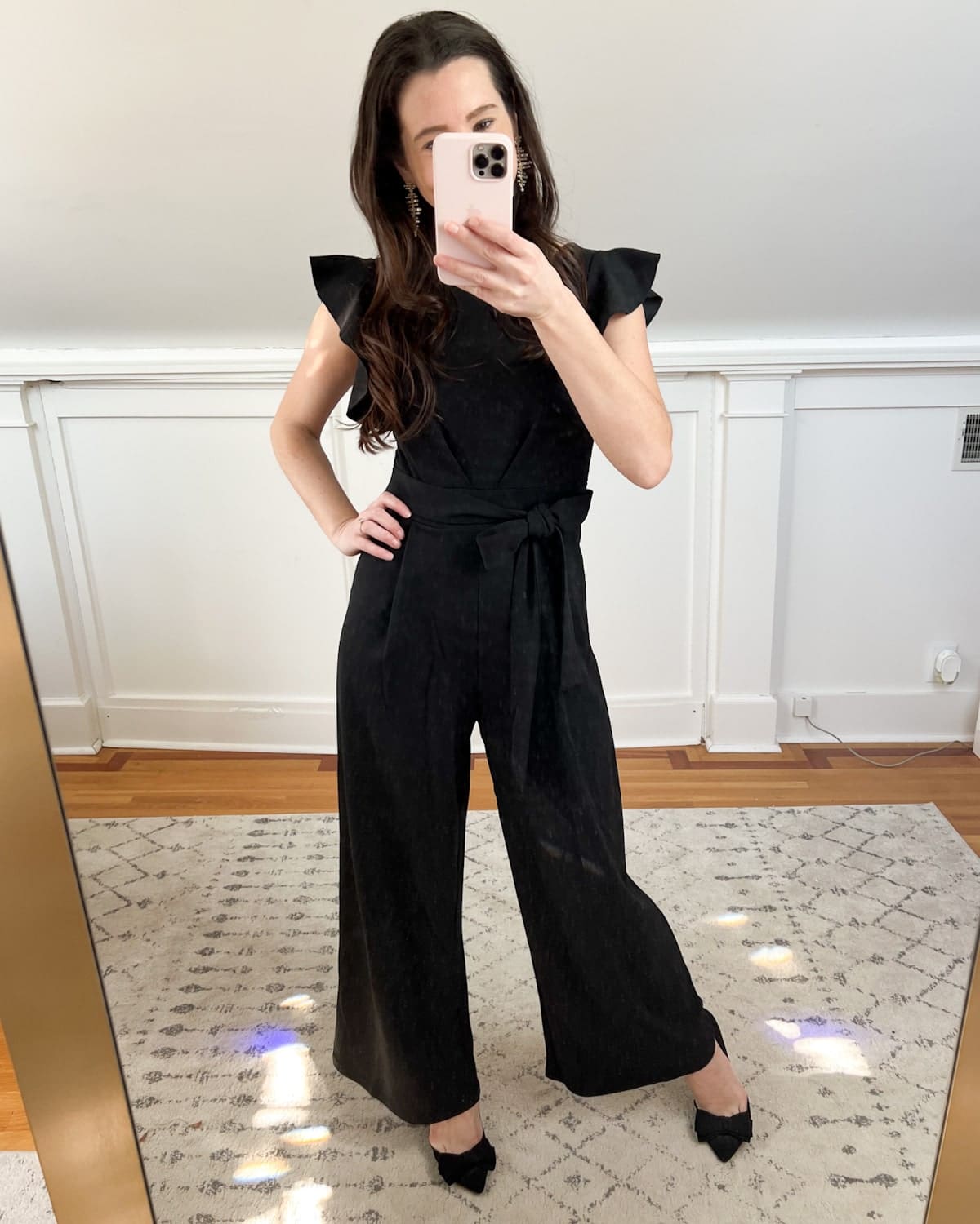Amazon black wide leg jumpsuit with sleeves styled for the holidays by affordable fashion blogger Stephanie Ziajka on Diary of a Debutante