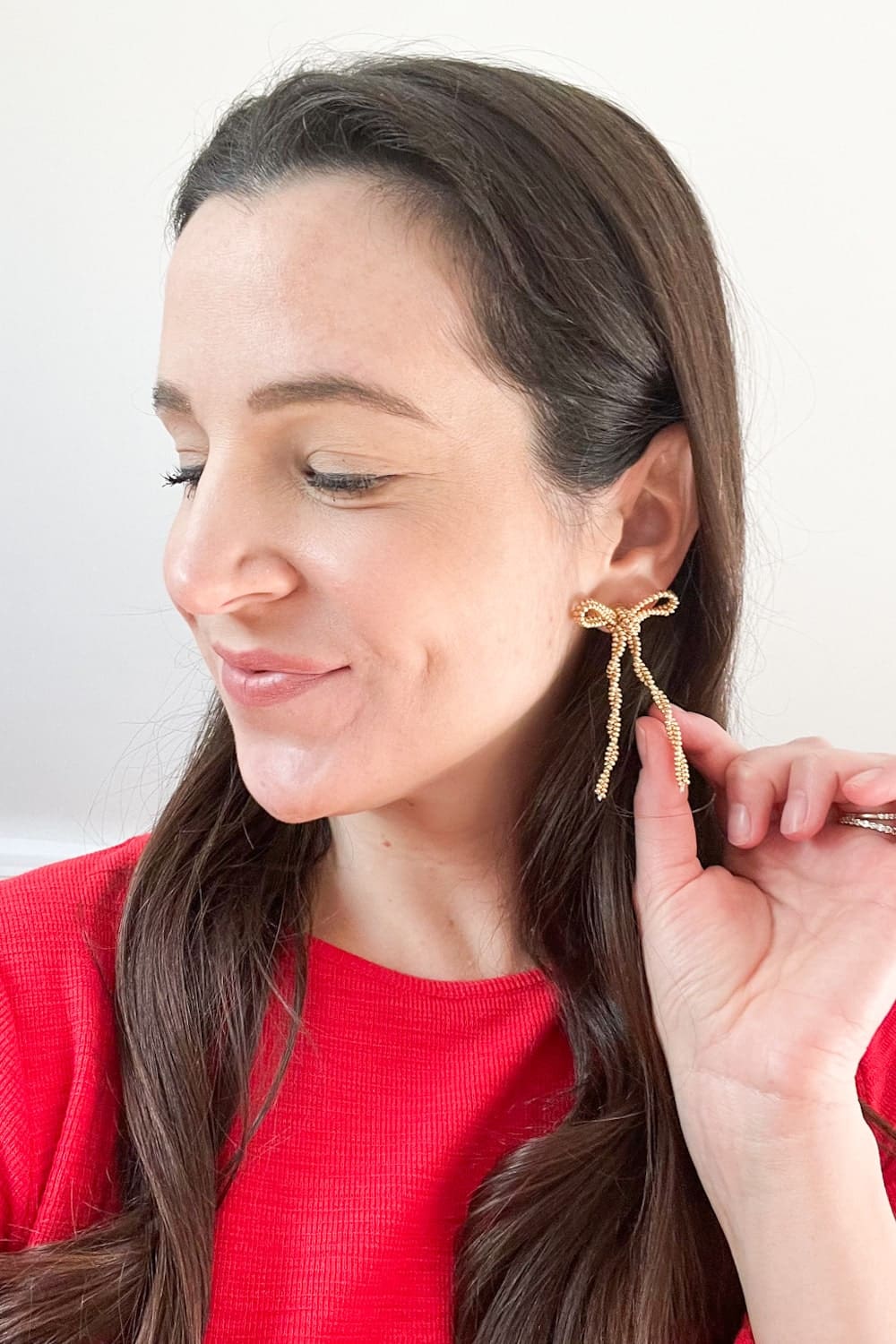 Sewcialite beaded gold bow earrings styled for the holidays by blogger Stephanie Ziajka on Diary of a Debutante