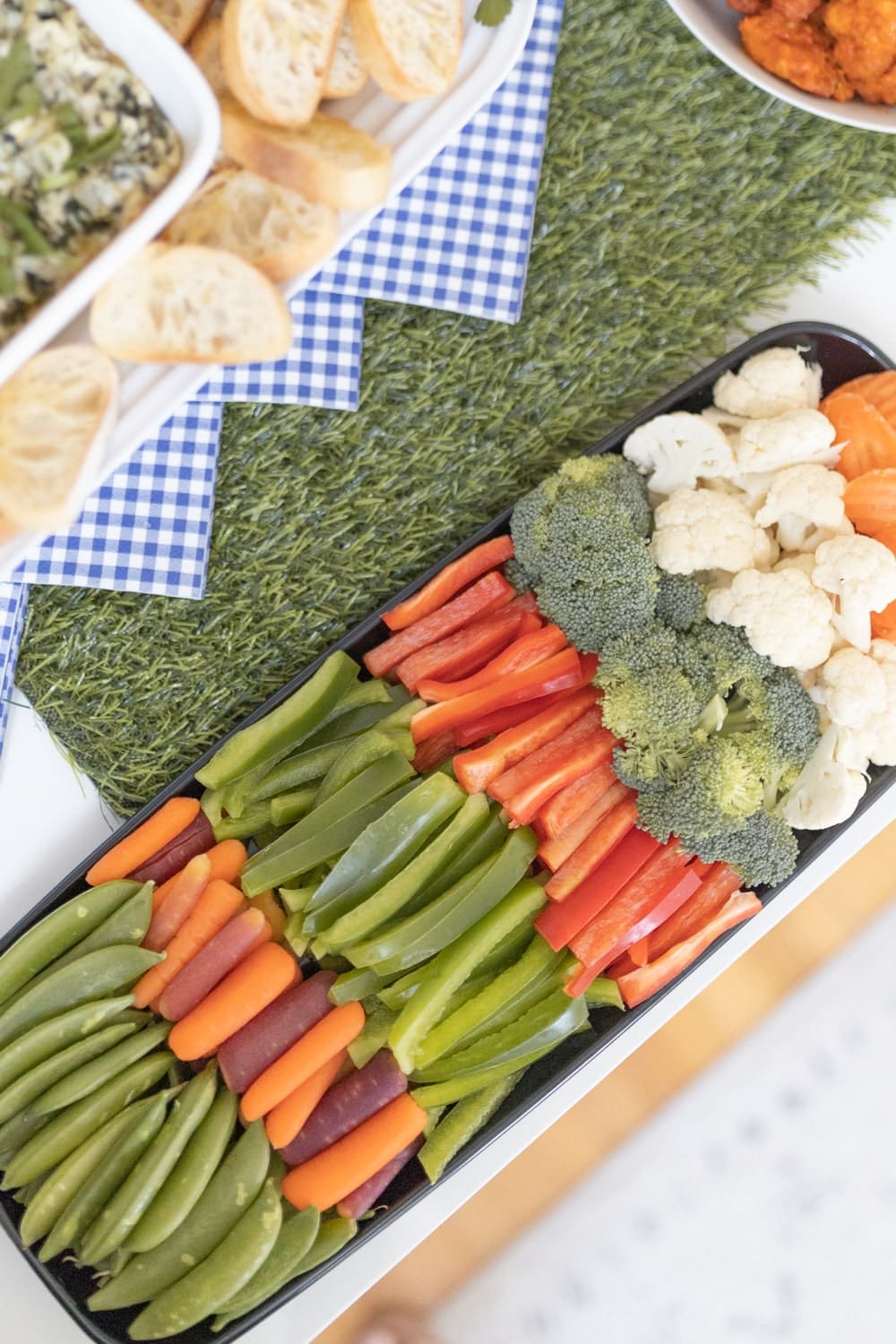 Blogger Stephanie Ziajka serves a Hy-Vee Signature Premier Veggie Platter for Game Day on Diary of a Debutante