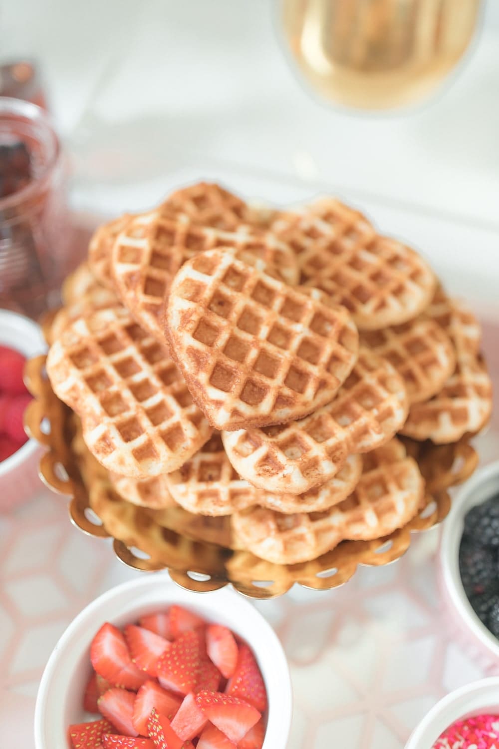 Heart shaped waffles cooked for Galentine's brunch by blogger Stephanie Ziajka on Diary of a Debutante