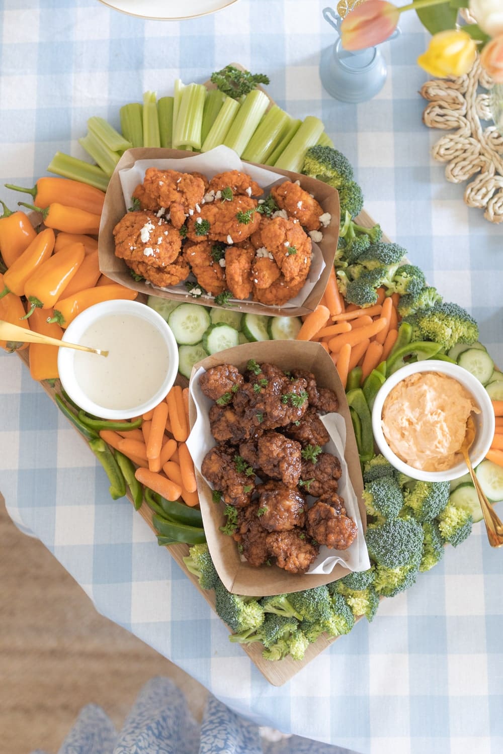 Blogger Stephanie Ziajka shares a chicken wing game day charcuterie board on Diary of a Debutante