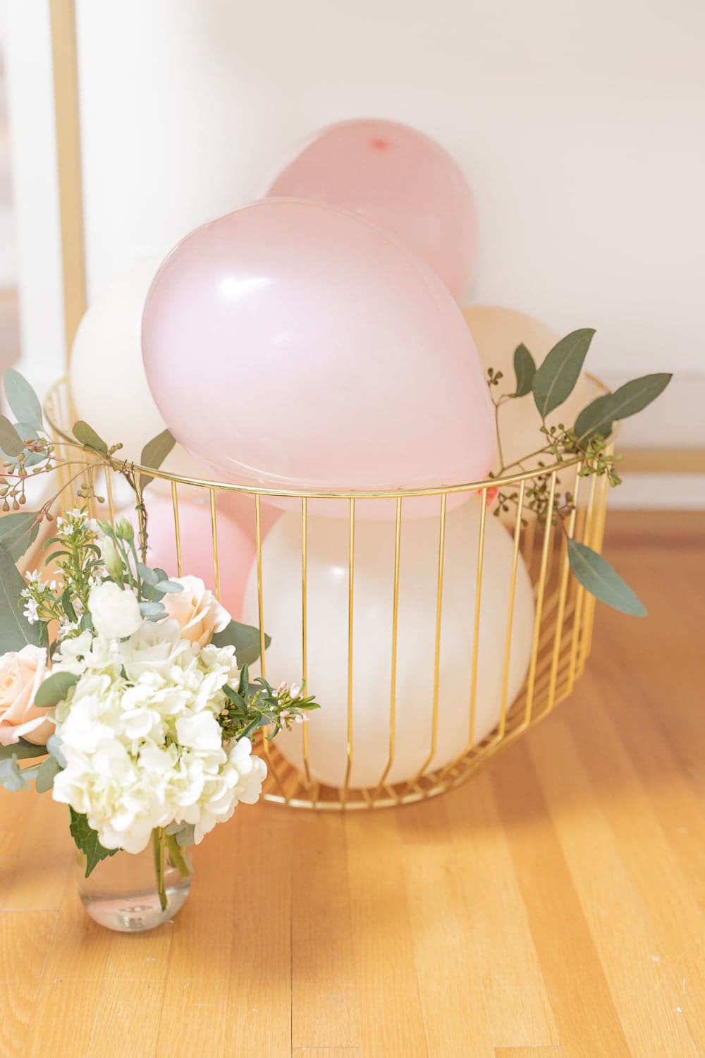 Blogger Stephanie Ziajka decorates with pink and white balloons in a basket on Diary of a Debutante