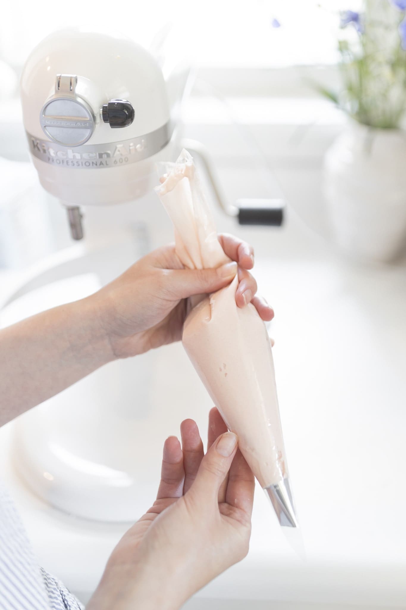 Blogger Stephanie Ziajka shows how to pipe buttercream roses onto mint julep cupcakes on Diary of a Debutante