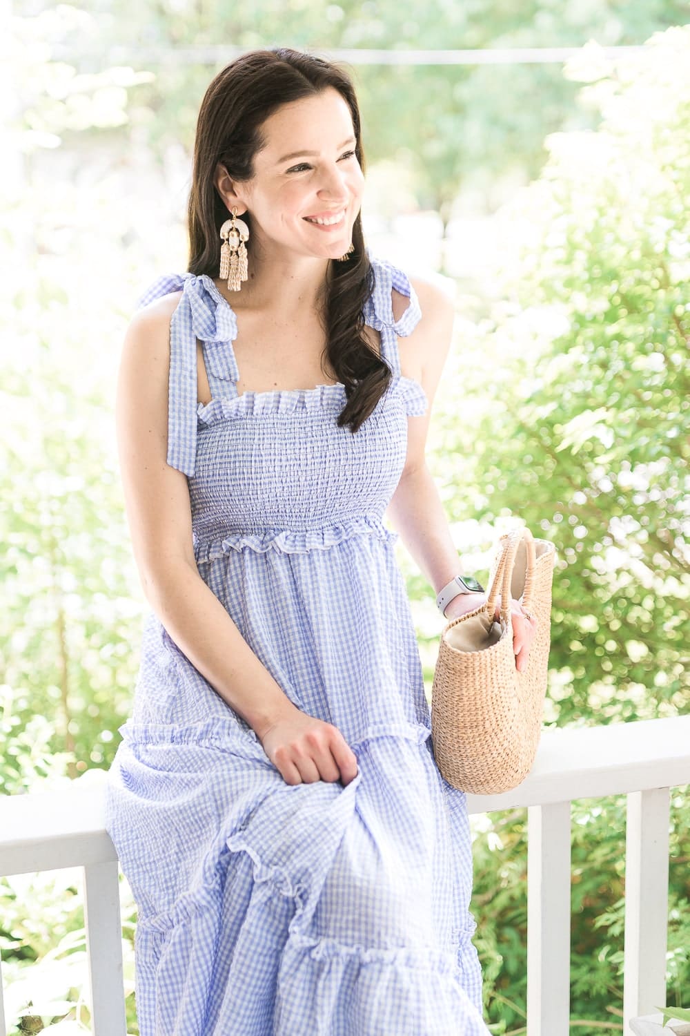 Affordable fashion blogger Stephanie Ziajka styles a summer wedding guest dress with Kendra Scott Masie Gold Statement Tassel Earrings on Diary of a Debutante