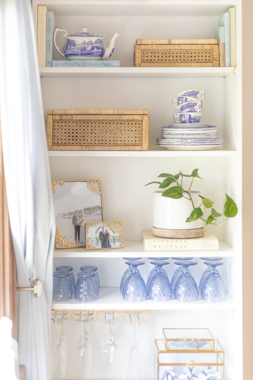 Coastal bookshelf decor from blogger Stephanie Ziajka on Diary of a Debutante